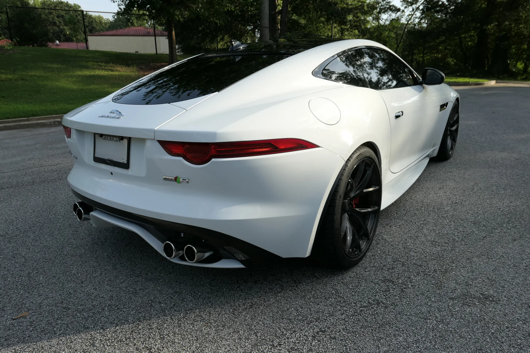 Rear three-quarter view of the Jaguar F-Type R showing its quad exhaust