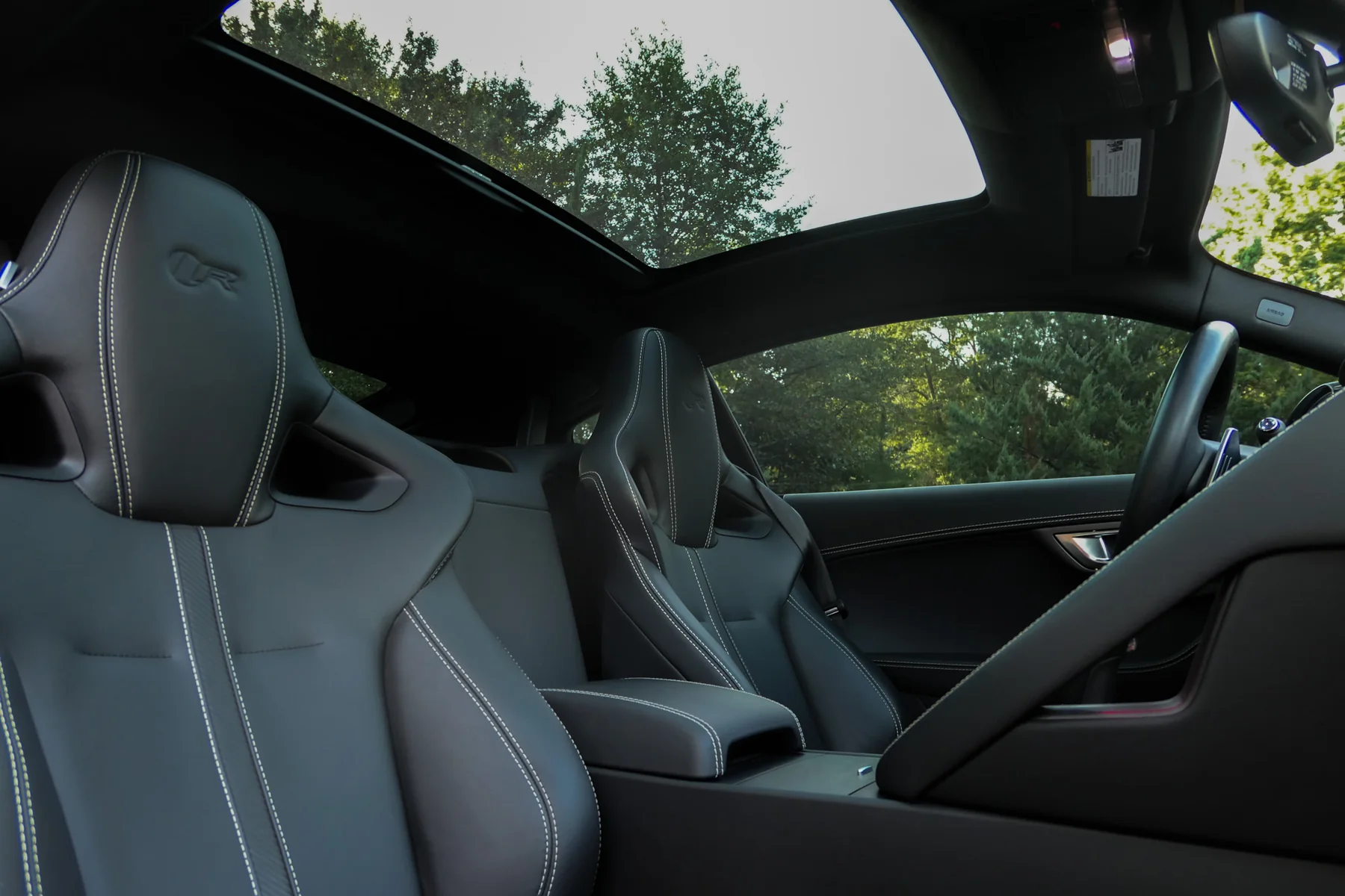 Cabin view showing performance seats and panoramic glass roof