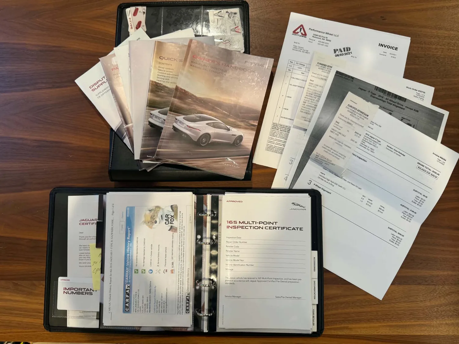 Maintenance records, CARFAX report and supporting sale documents laid out together